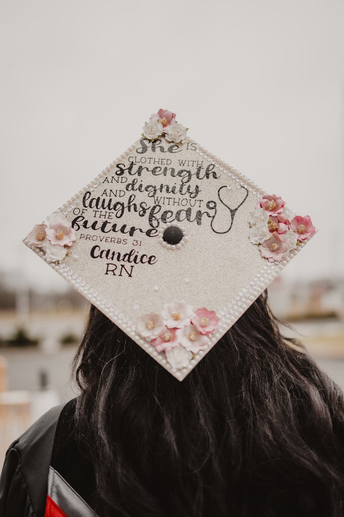 Decorated student nurse graduation cap with an inspiring quote and floral design.